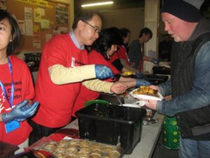 Michael is serving hot food at Mustard Tree - 2012