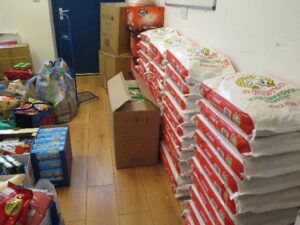 Chinese community donation of aid for food bank.