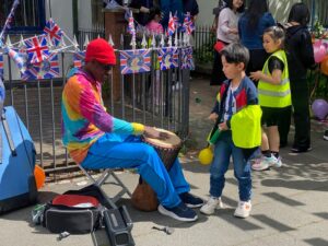 Danny Henry teaches Chinese children South American Culture in the form of rhythm dancing and samba music. It is great fun
